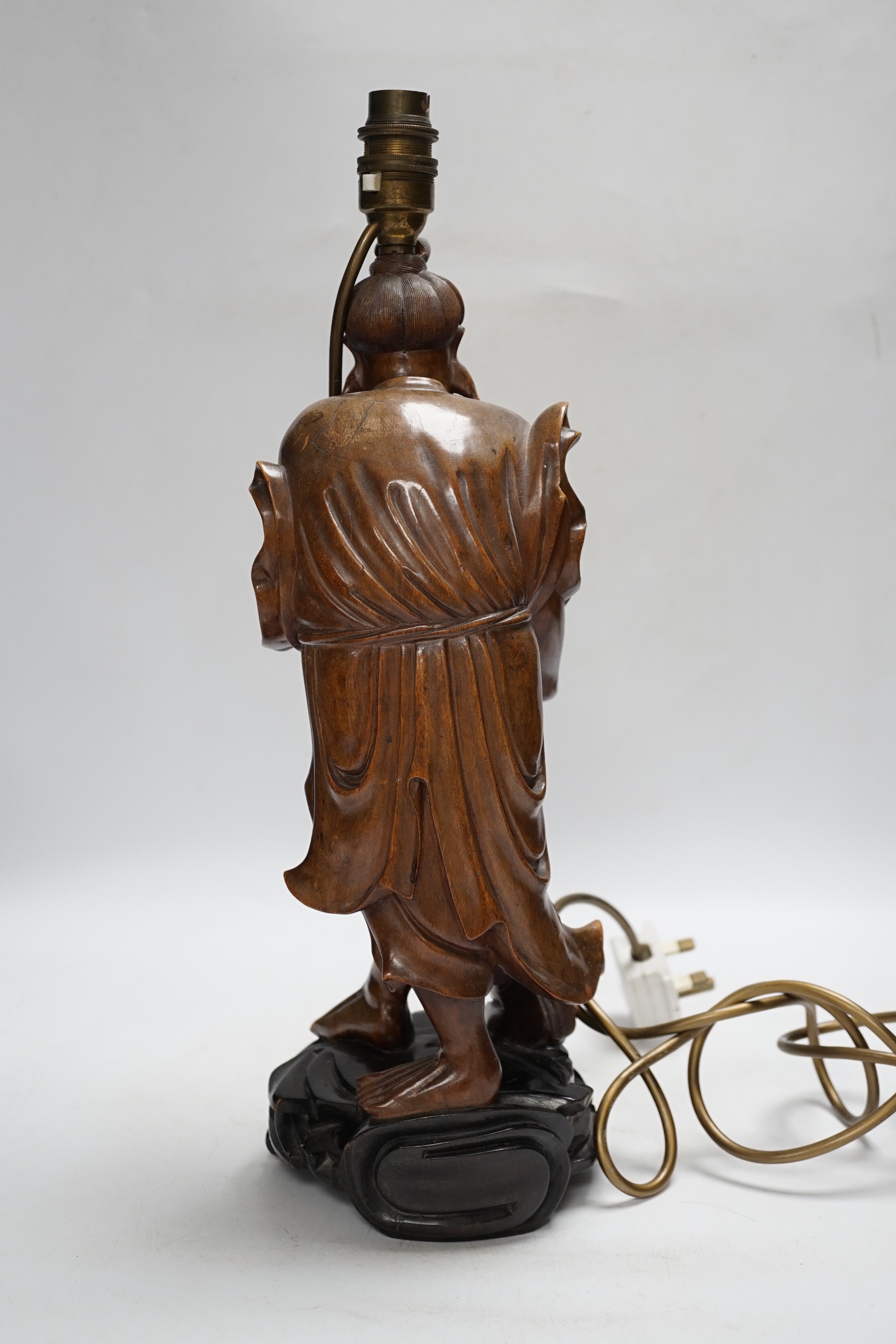 A Chinese carved wood figural table lamp, 43cm total